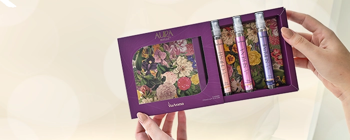 três unidades do Aura Parfum dentro de uma caixa